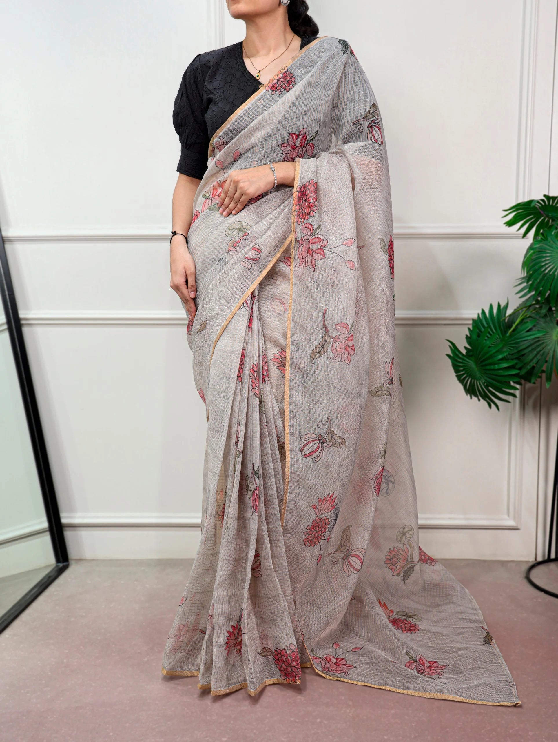 teal kota doria saree pallu border closeup floral print
