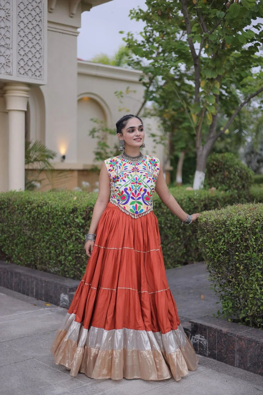 Kutchi work navratri lehenga rust terracotta skirt smiling model