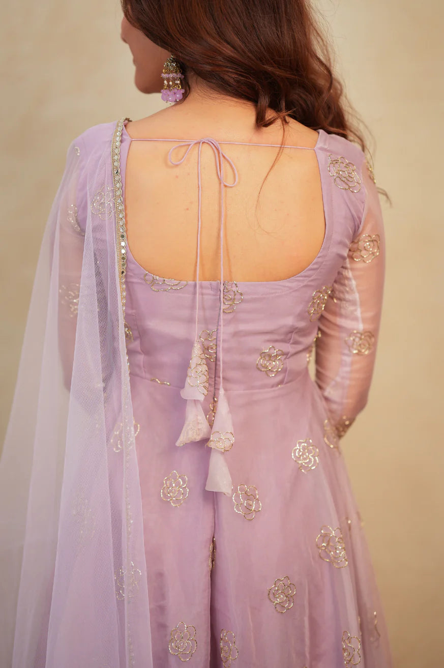 Open tie-back detail of lavender organza anarkali with white tassel strings – back view