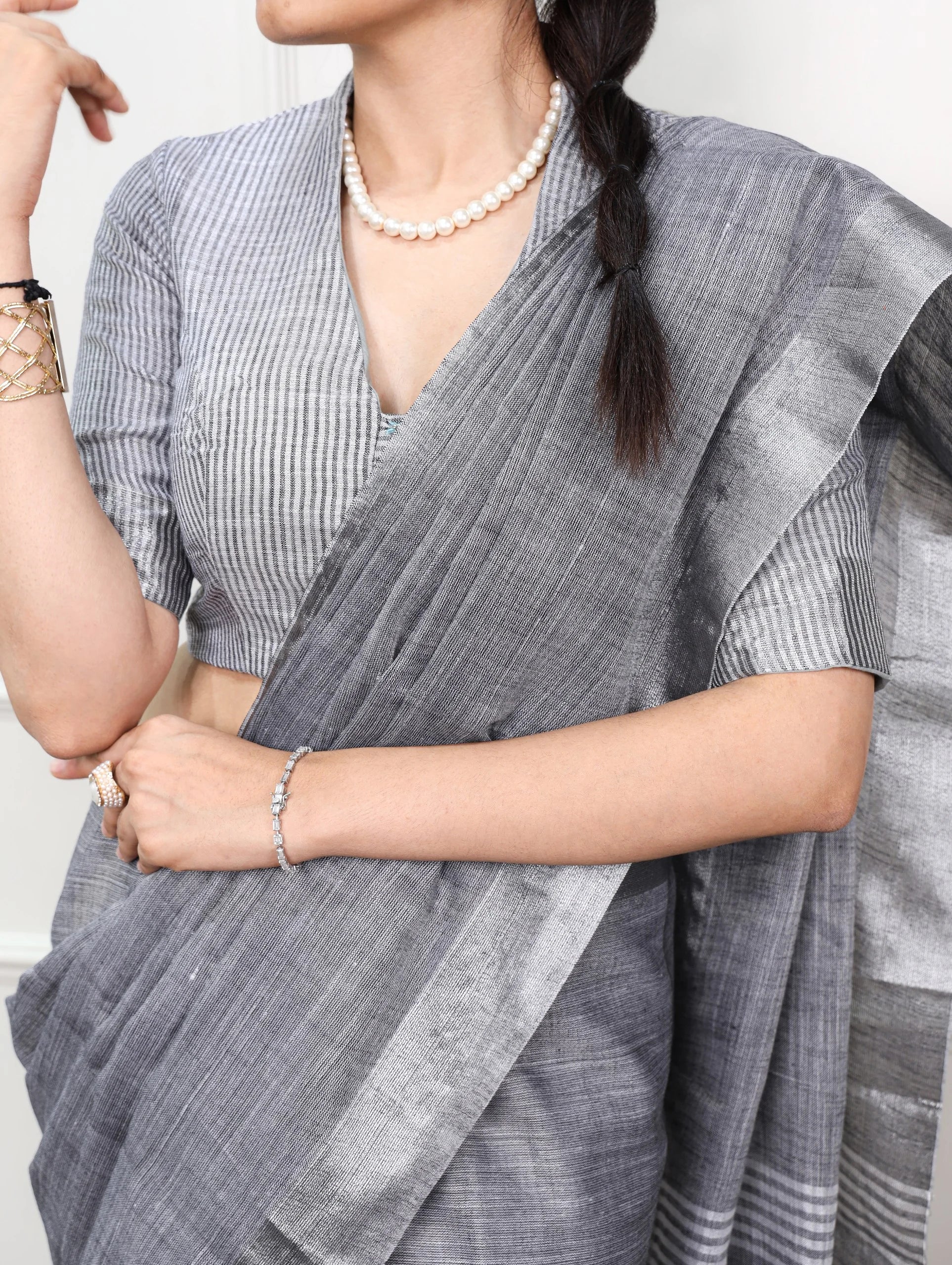 linen saree zari border charcoal grey close-up drape