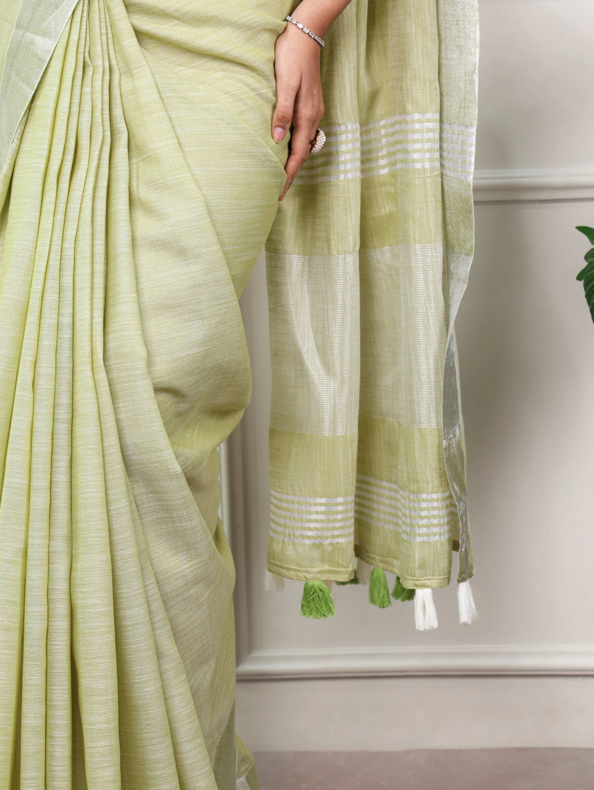 pistachio green linen saree zari border pallu tassels detail