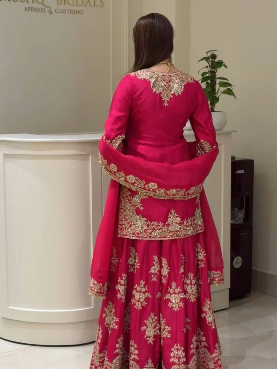 Magenta sharara set back view showing embroidery coverage on kurti and palazzo