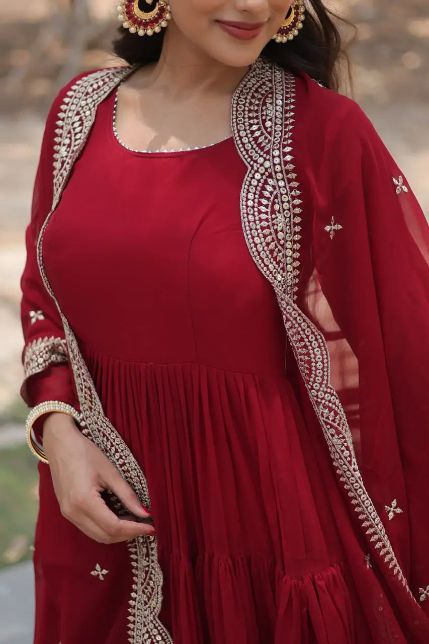 Maroon tiered anarkali gown neckline and gold sequin embroidered dupatta close-up detail