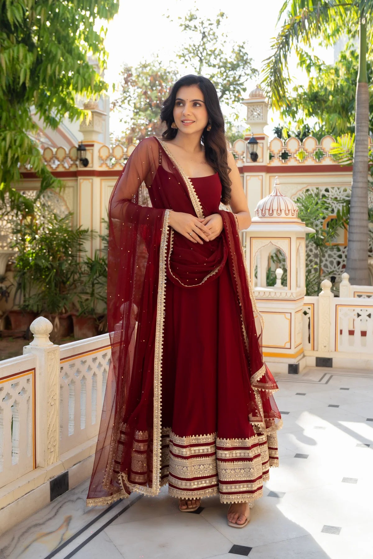 Maroon georgette anarkali gown with square neck, gold zari hem border and net dupatta - front view