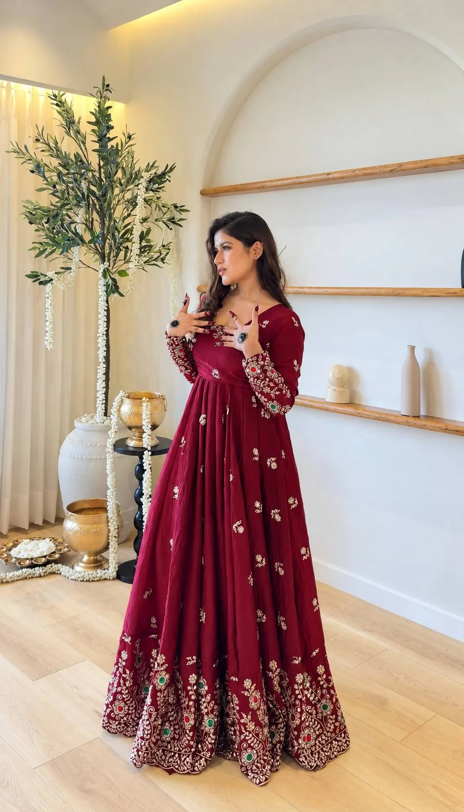 Maroon crush anarkali gown worn full length with embroidered hem – festive view