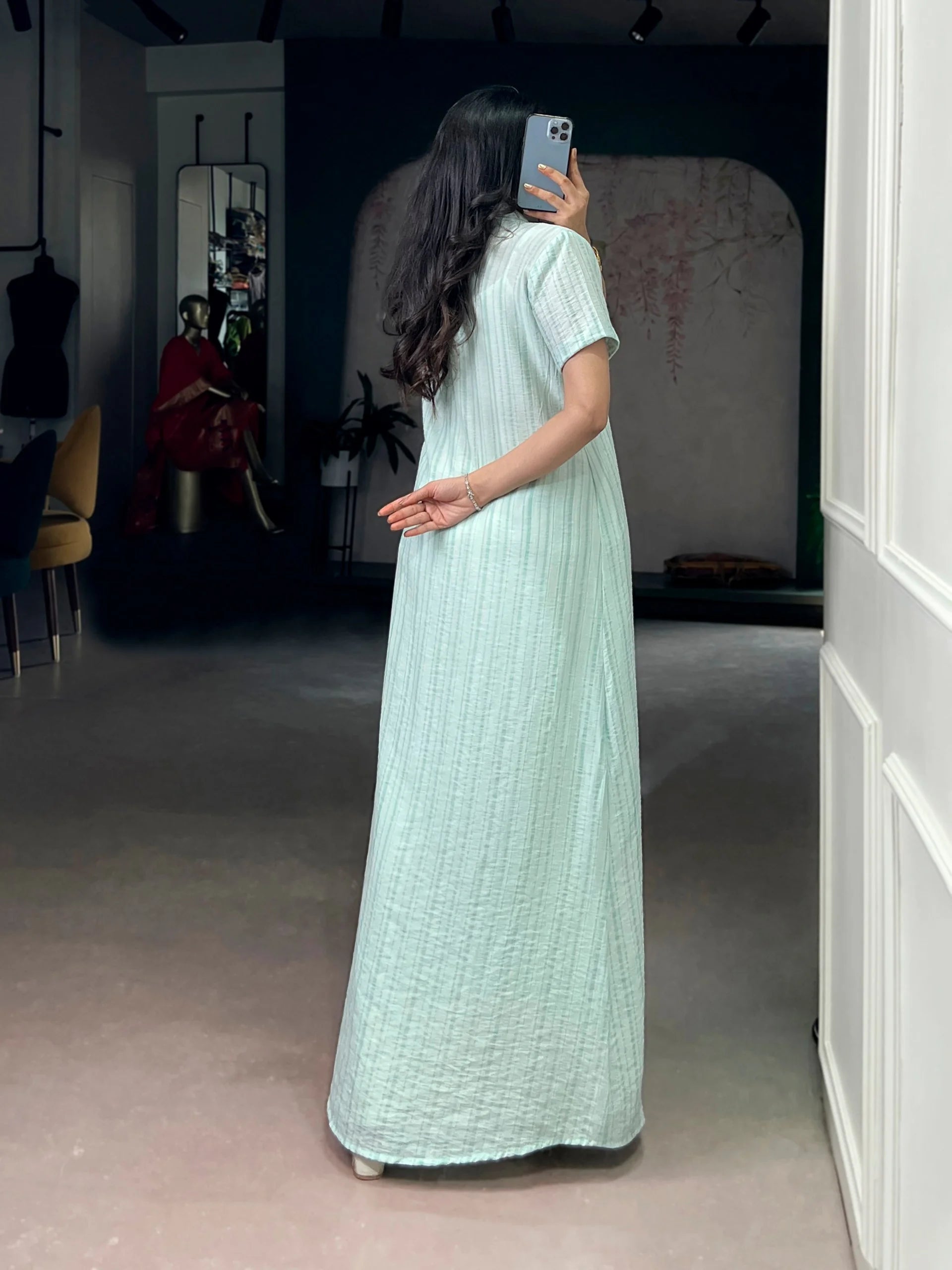 Back view of mint green indo western set with floor-length stripe shrug