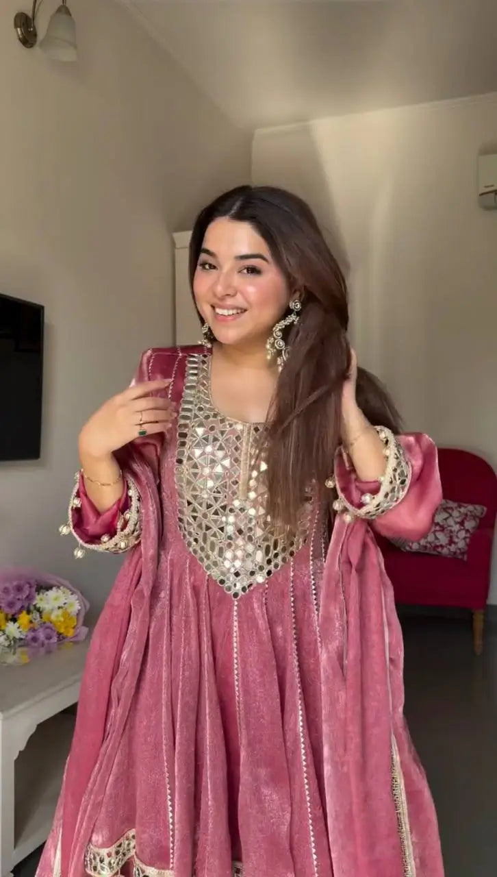 Pink velvet Anarkali gown with mirror work, perfect for festive occasions and ethnic wear