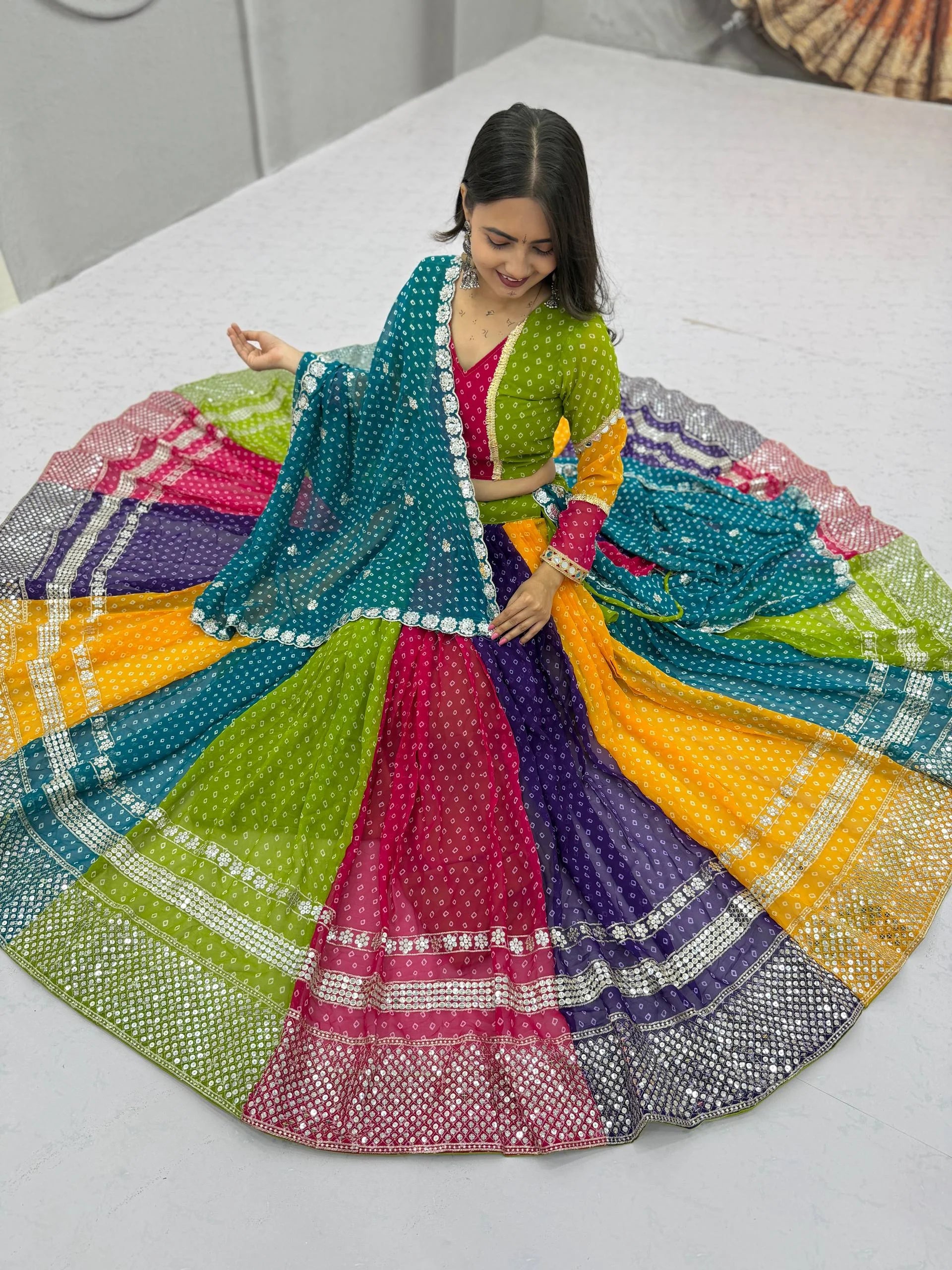 Georgette bandhani lehenga choli aerial spread – full six metre flair for garba
