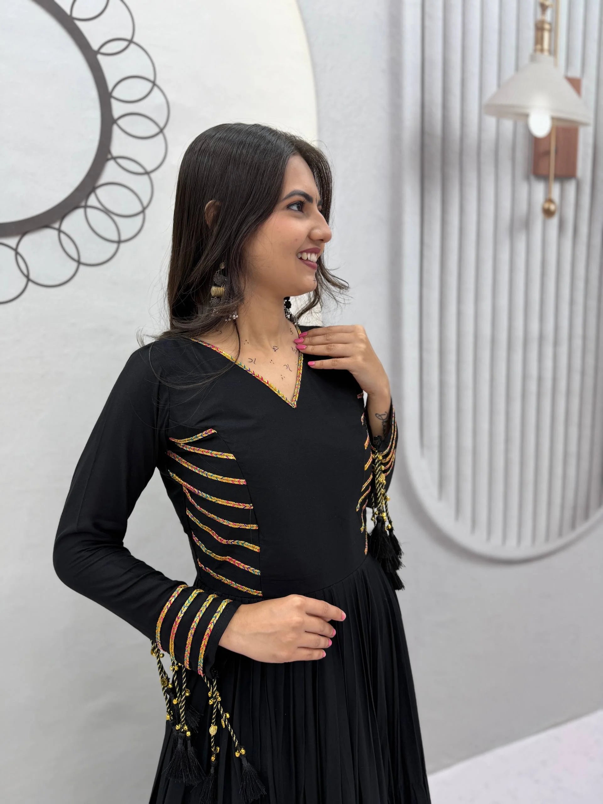 Navratri garba gown black bodice closeup multicolor braid stripe hand work