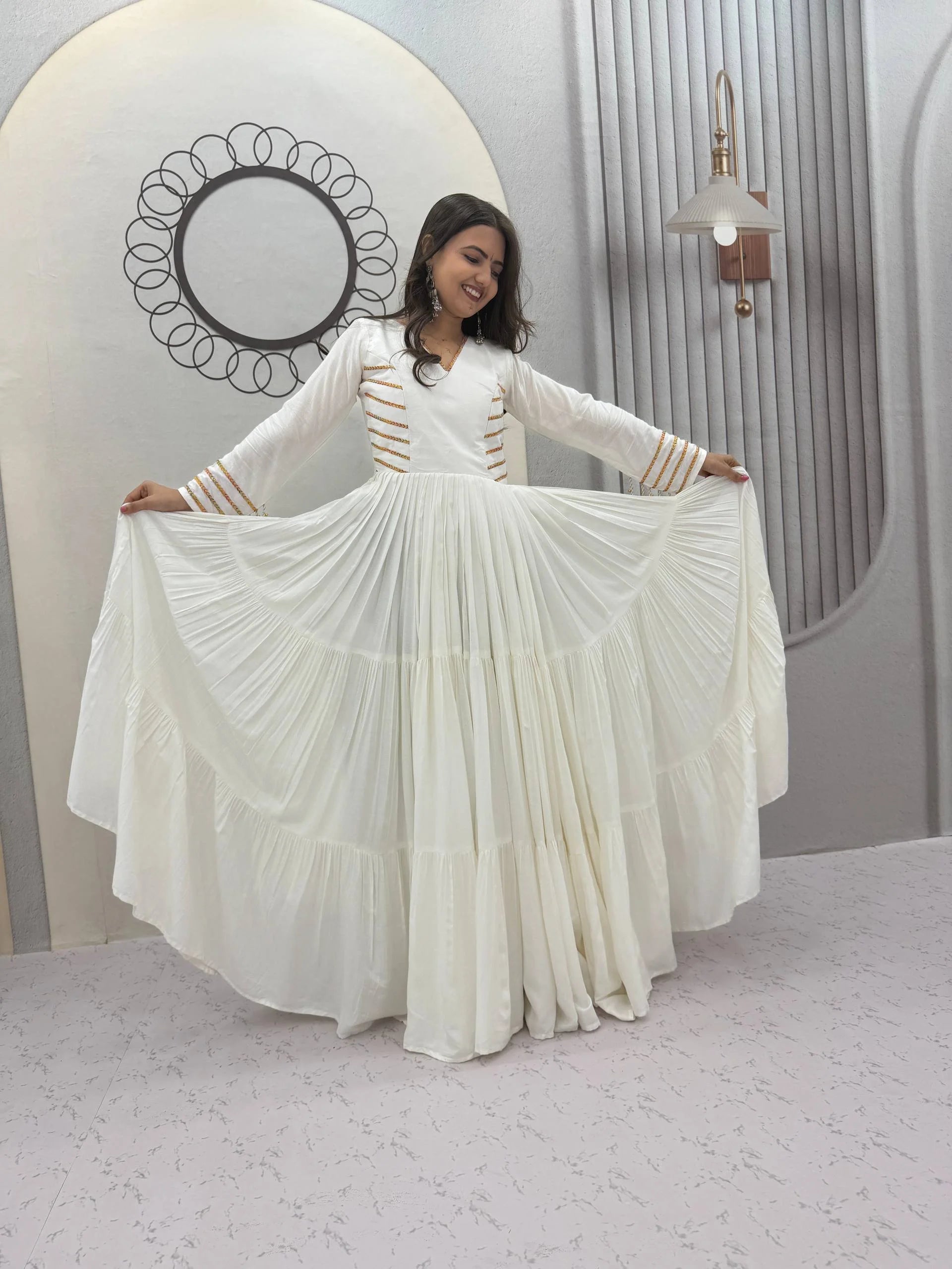 White navratri gown for women full view spreading tiered skirt cotton hand work