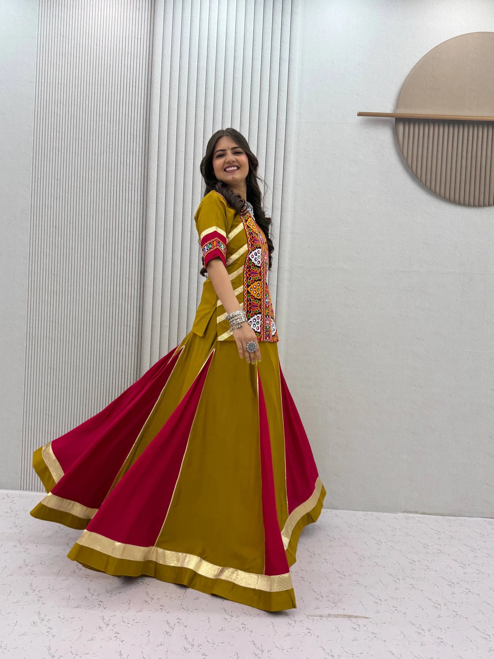 navratri kediyu lehenga mustard yellow magenta spinning side view