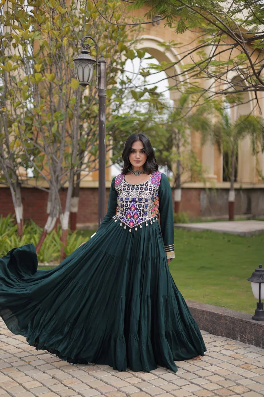 Green navratri gown twirl showing the four-layer tiered rayon flair, dance view