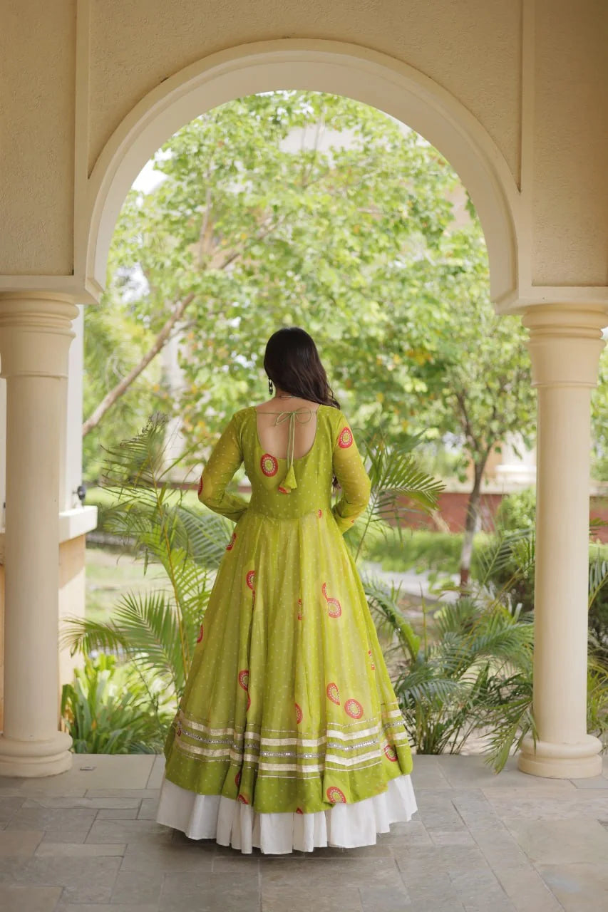 back view of red navratri kurti lehenga with tiered kora cotton lehenga