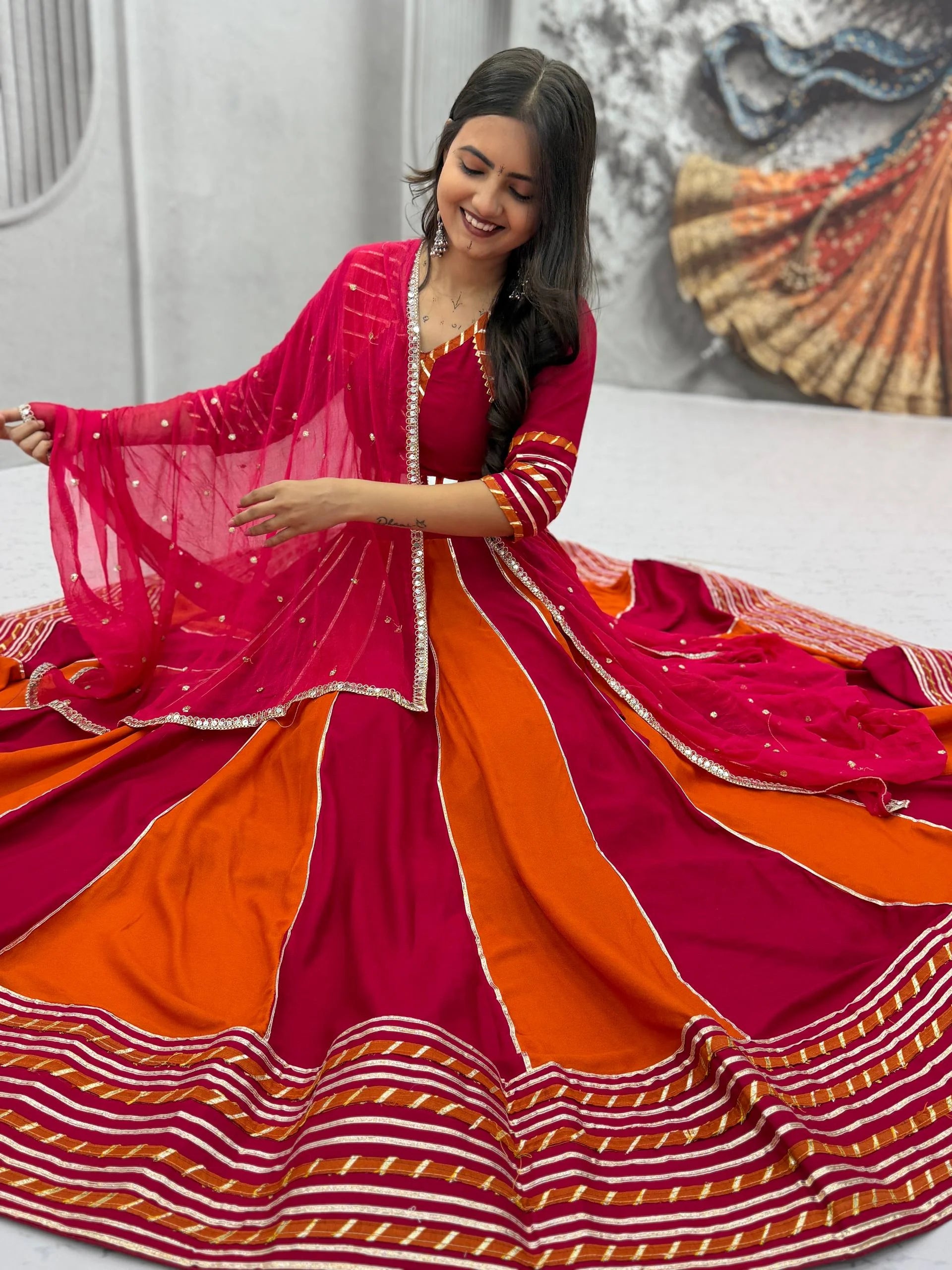 Navratri lehenga choli bicolor panel red teal seated aerial view