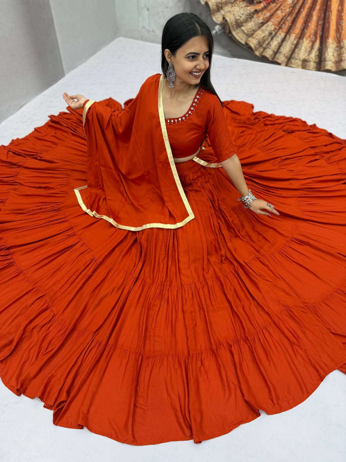Orange navratri lehenga choli mirror work sitting 12 meter