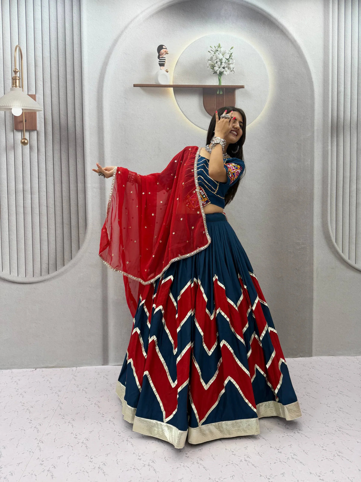 Navratri lehenga choli navy red dupatta pose festive style