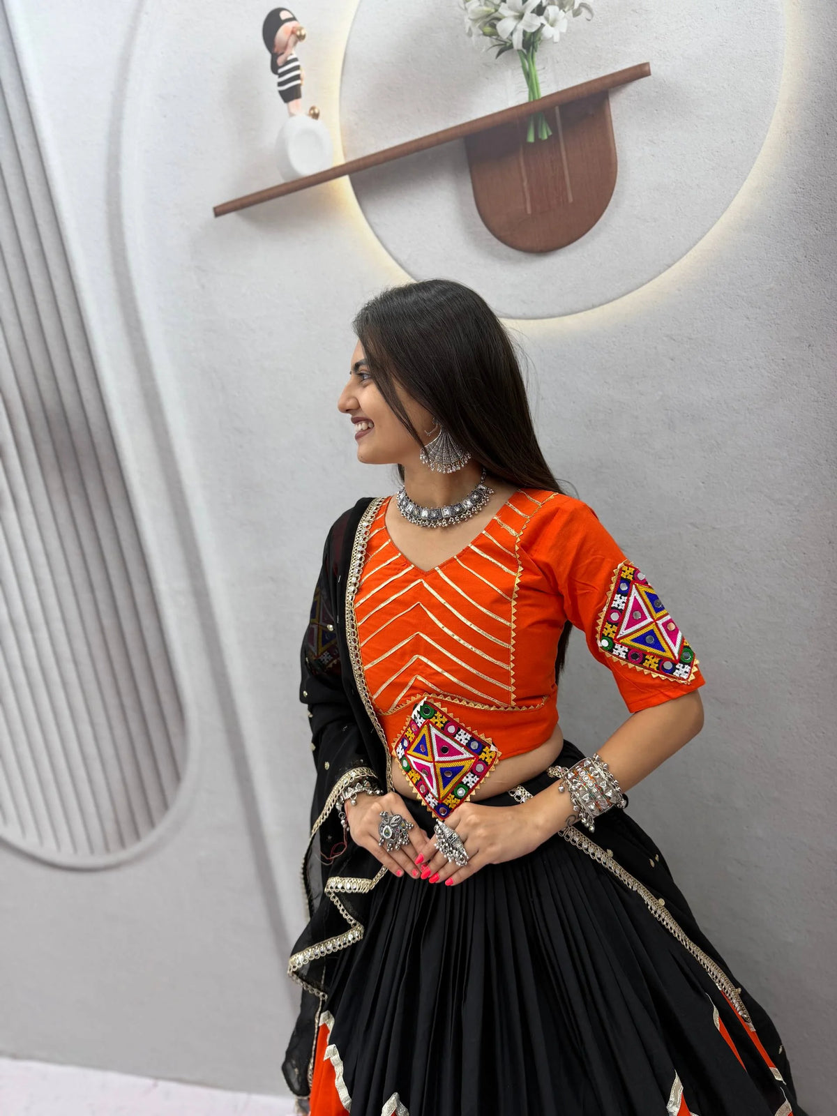Navratri lehenga choli in orange and black rayon cotton — side view