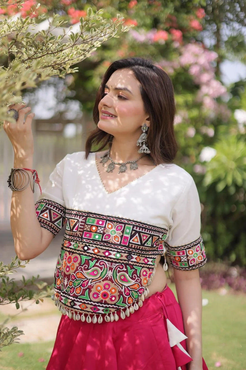 Navratri lehenga choli pink lehenga white Kutchi top front posing