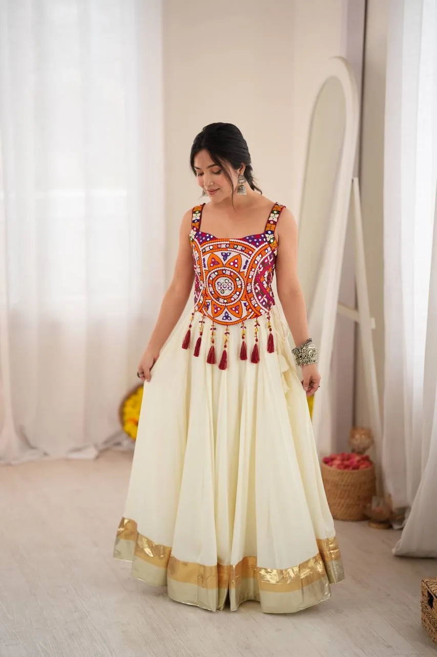 Off white navratri chaniya choli with multicolour Kutchi mirror-work choli, gold zari border and cream flair — front view