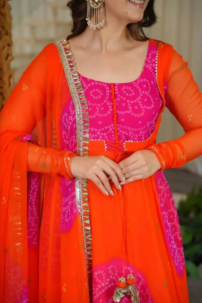 Orange bandhani anarkali suit full-length mirror view with gota patti georgette dupatta