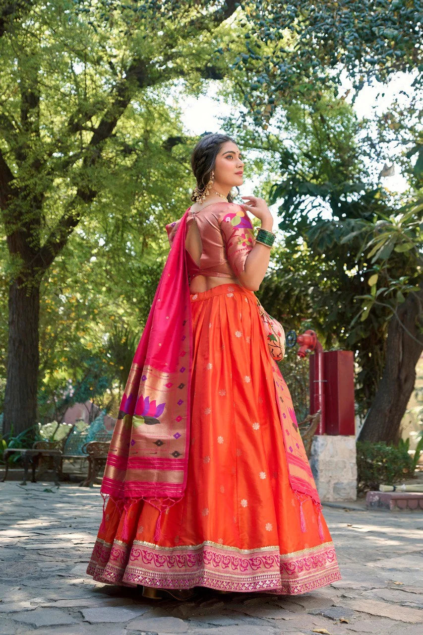 Orange Paithani lehenga back view showing 4m flare with handmade tassels at hem