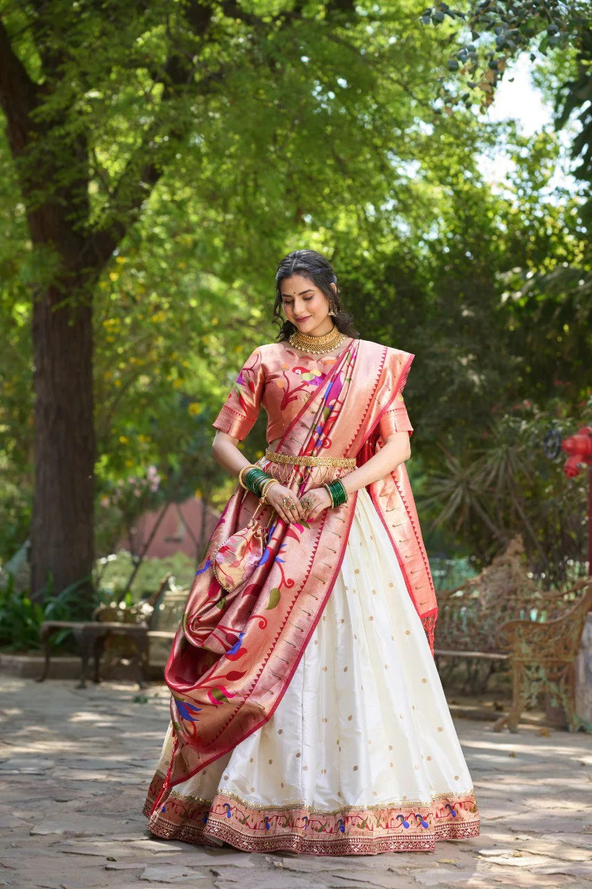 White Paithani lehenga set sitting on bench with pink dupatta and batwa
