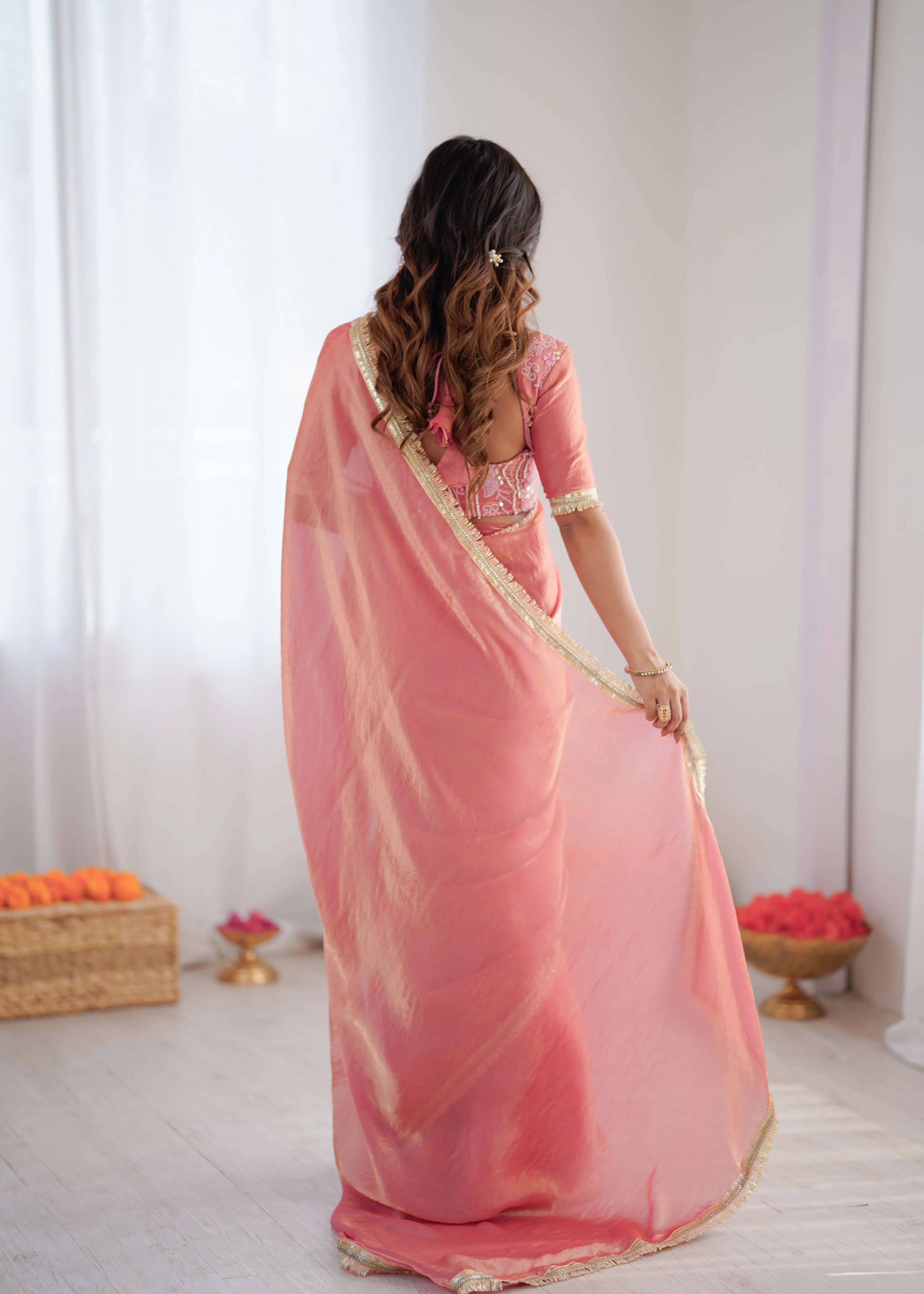 peach pink georgette designer saree flowing back pallu view