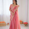 peach pink heavy georgette saree with thread sequin embroidered blouse front standing