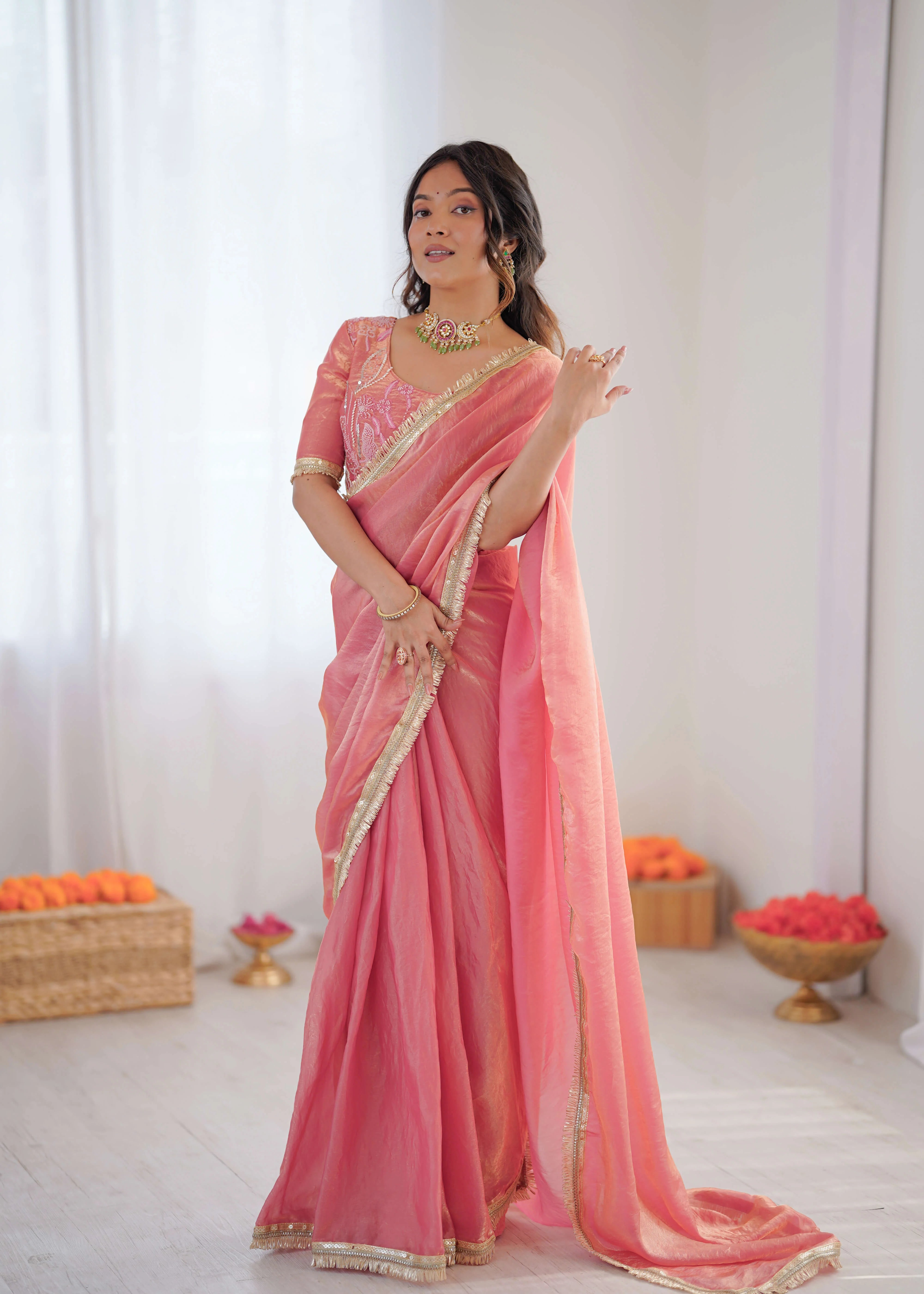 peach pink heavy georgette saree with thread sequin embroidered blouse front standing