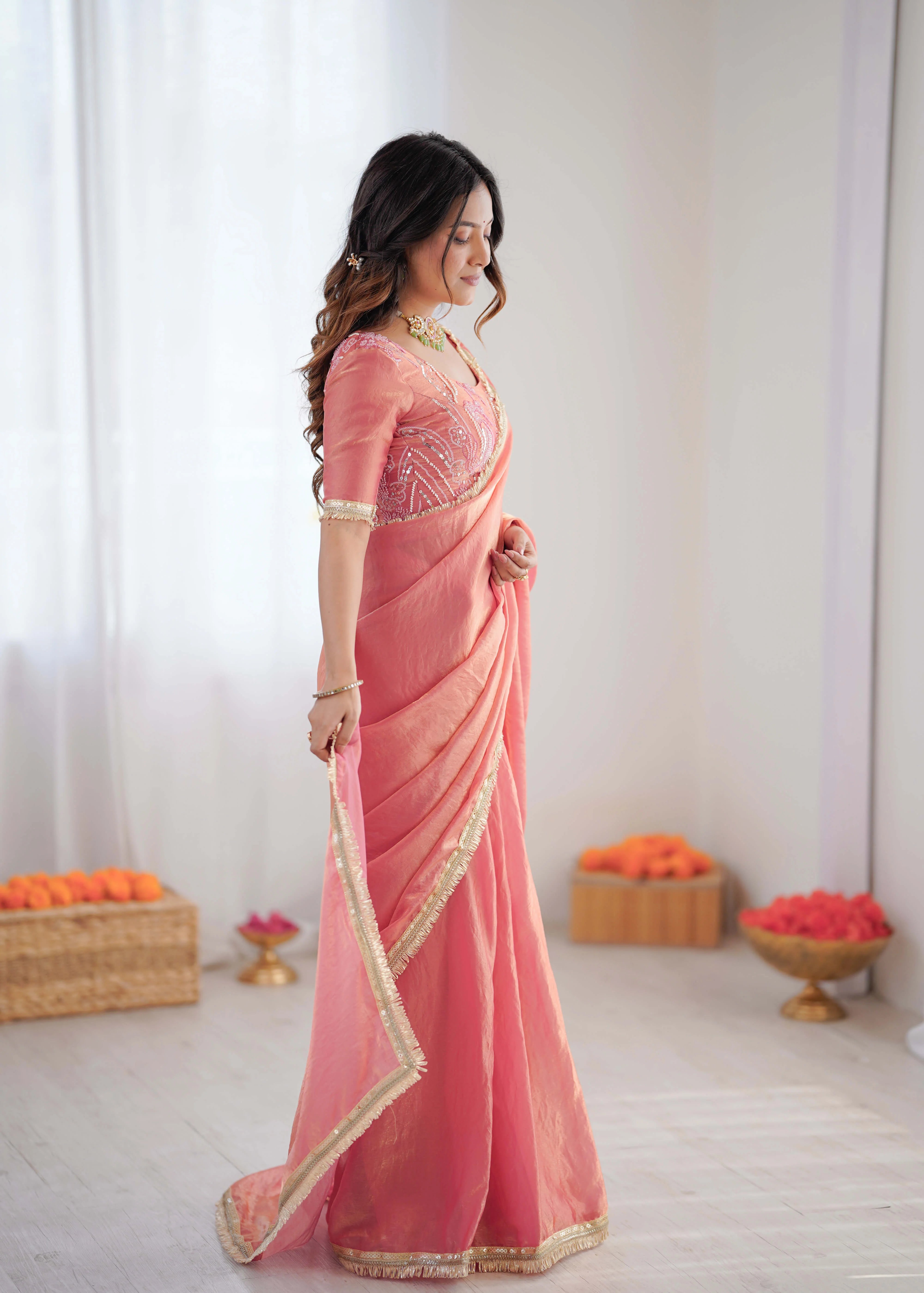 peach pink heavy georgette saree side profile gold fringe border