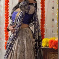 Woman in traditional outfit with decorative background