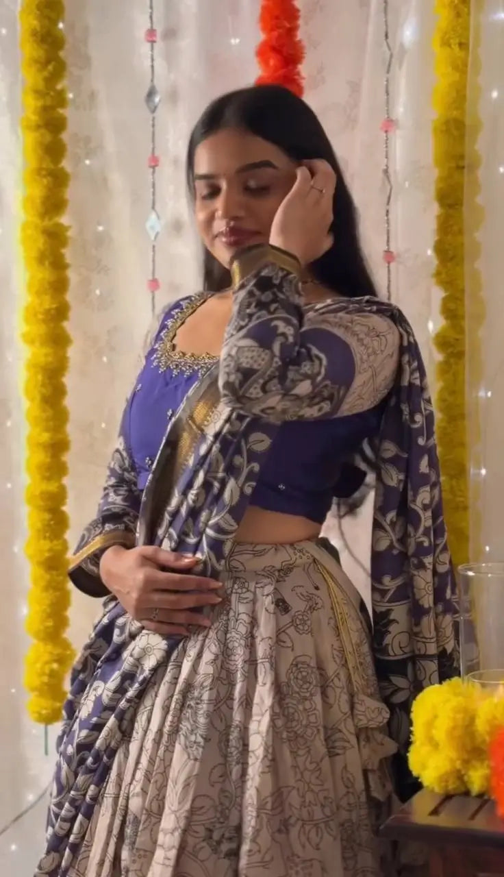 Woman in traditional attire with decorative elements in the background