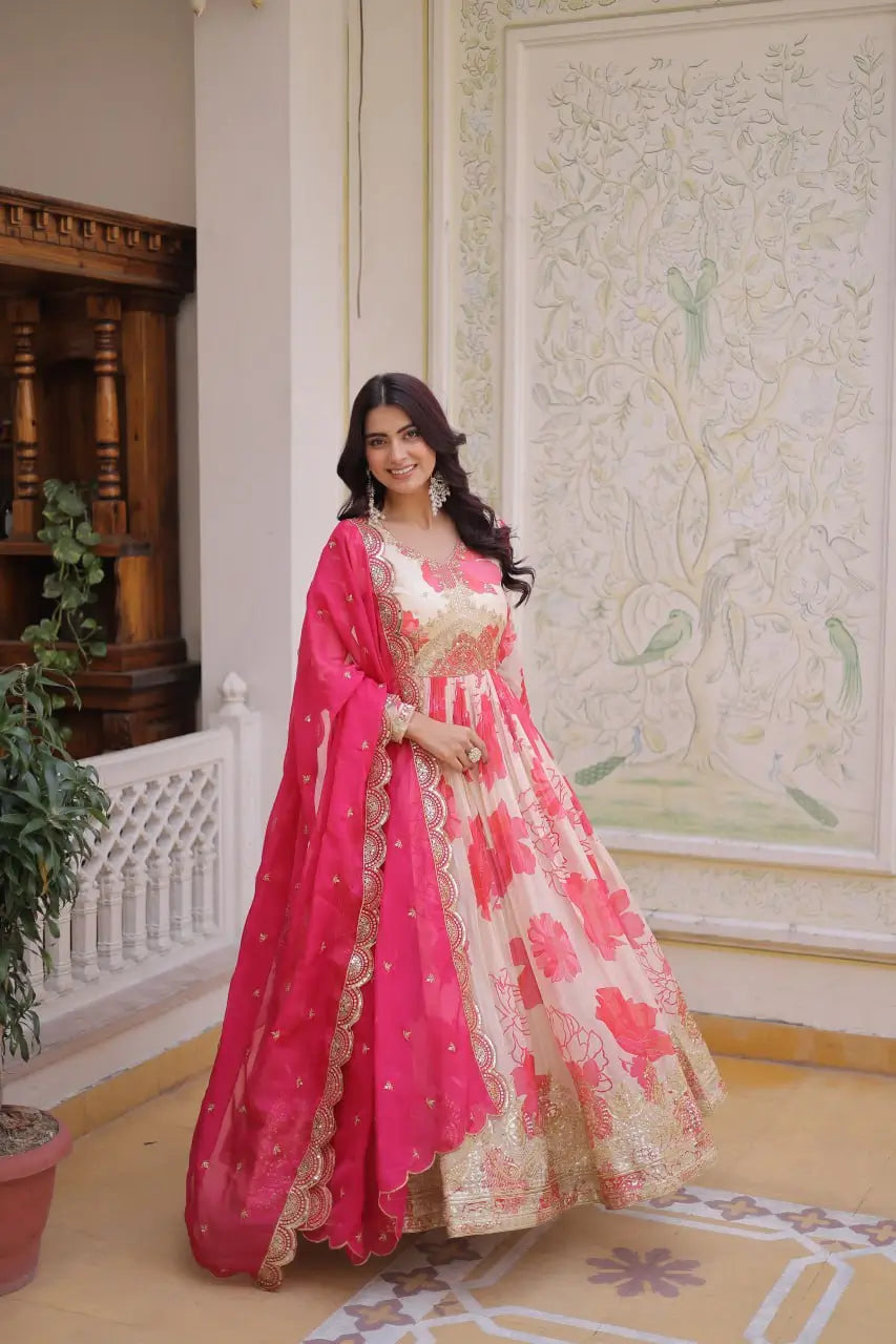 Full view of pink floral print anarkali gown with gold zari embroidery and hot pink dupatta