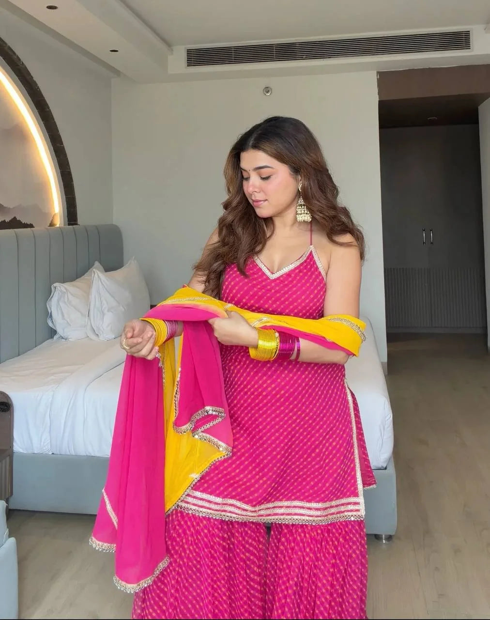 Rani pink sharara set with dupatta draped – mirror and lace work detail