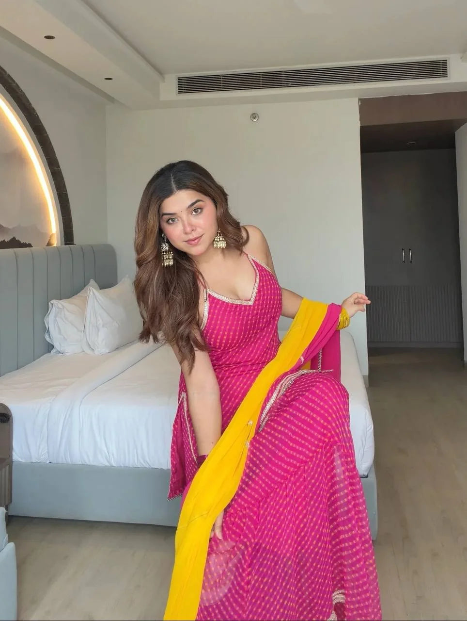 Pink georgette sharara set with mirror lace border – seated side view