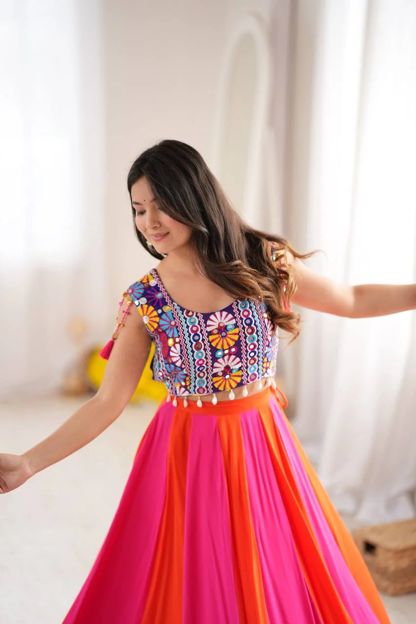 pink orange navratri lehenga with gota patti lace work and mirror work choli dance pose
