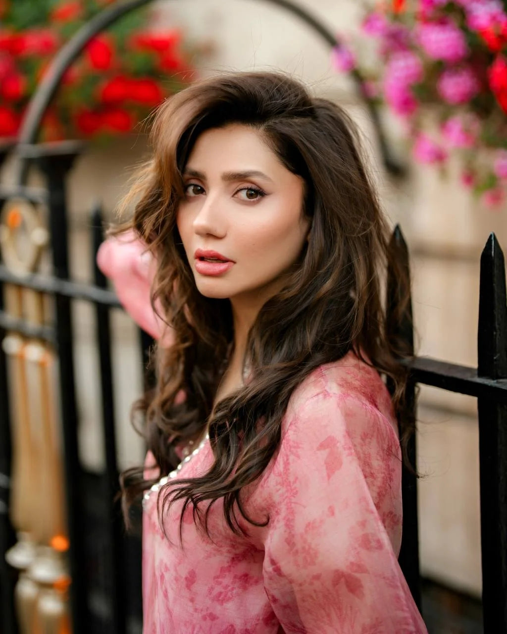 Pink organza kurta set with real mirror work and balloon sleeves – model close-up