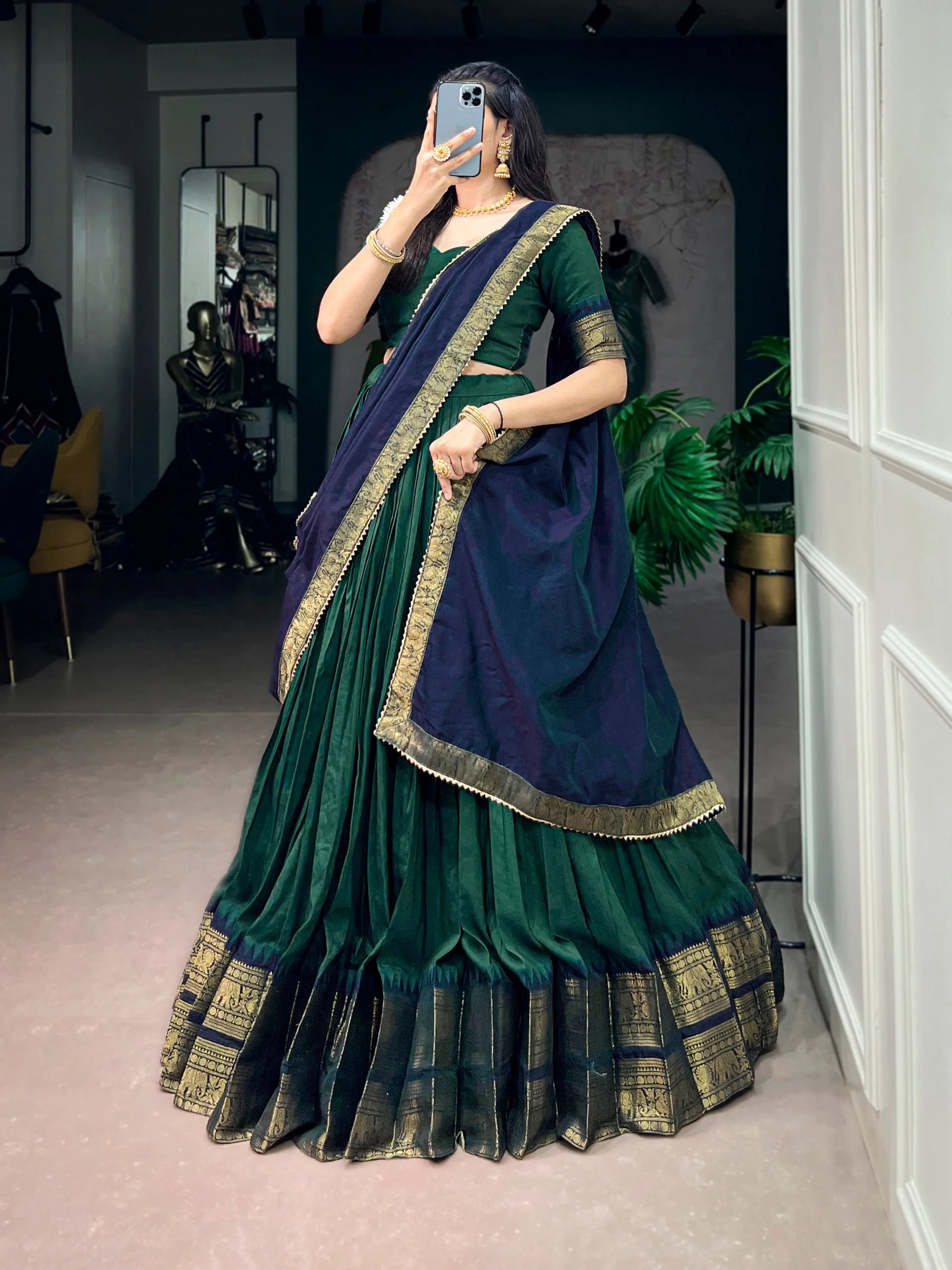 Dark green lehenga choli zari border back view 4-metre flair