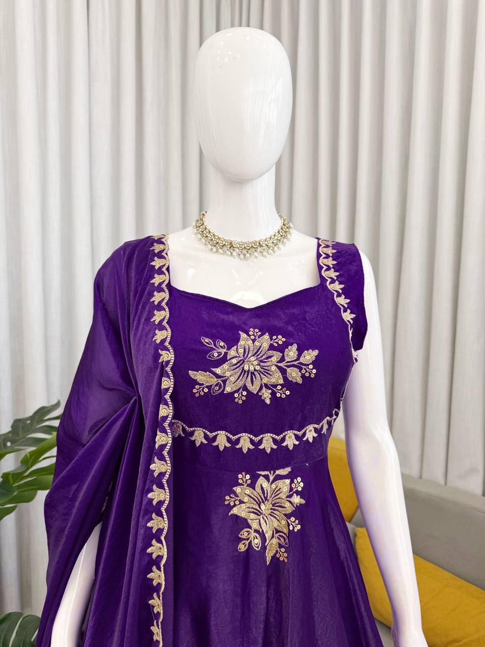 Close-up of royal purple embroidered Anarkali palazzo set with gold floral design and dupatta