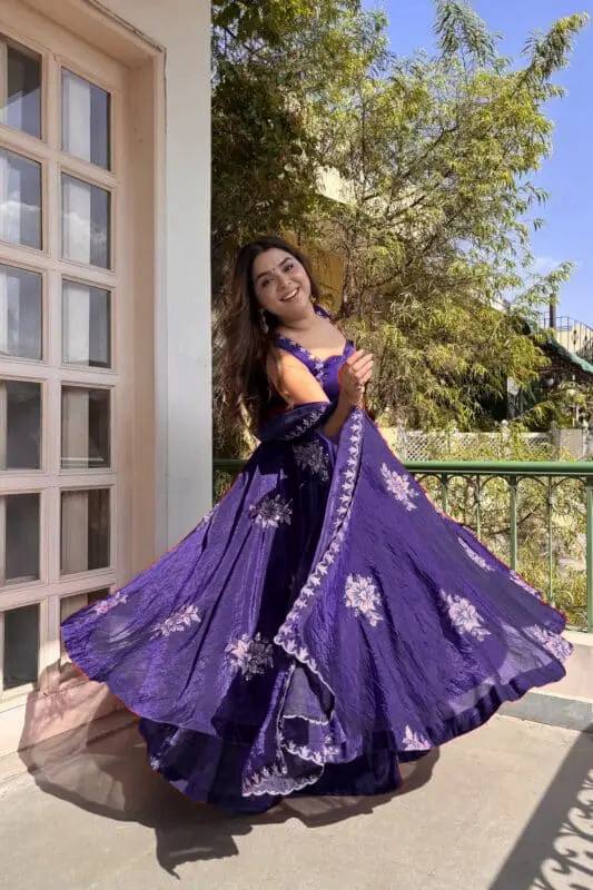Model showcasing royal purple Fendy silk embroidered Anarkali palazzo set with dupatta front view