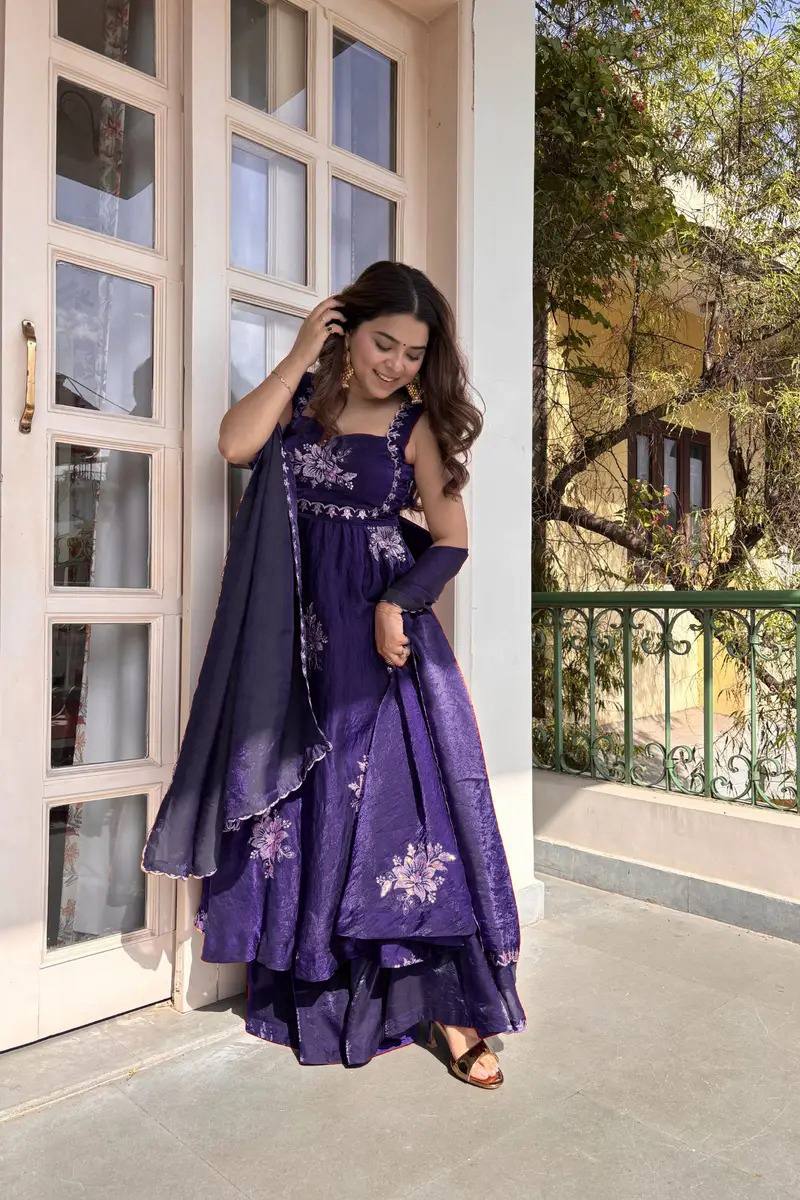 Royal purple embroidered Anarkali palazzo set with dupatta twirl pose Indian festive and wedding wear
