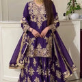 Model wearing purple chinon silk sharara set with dupatta drape