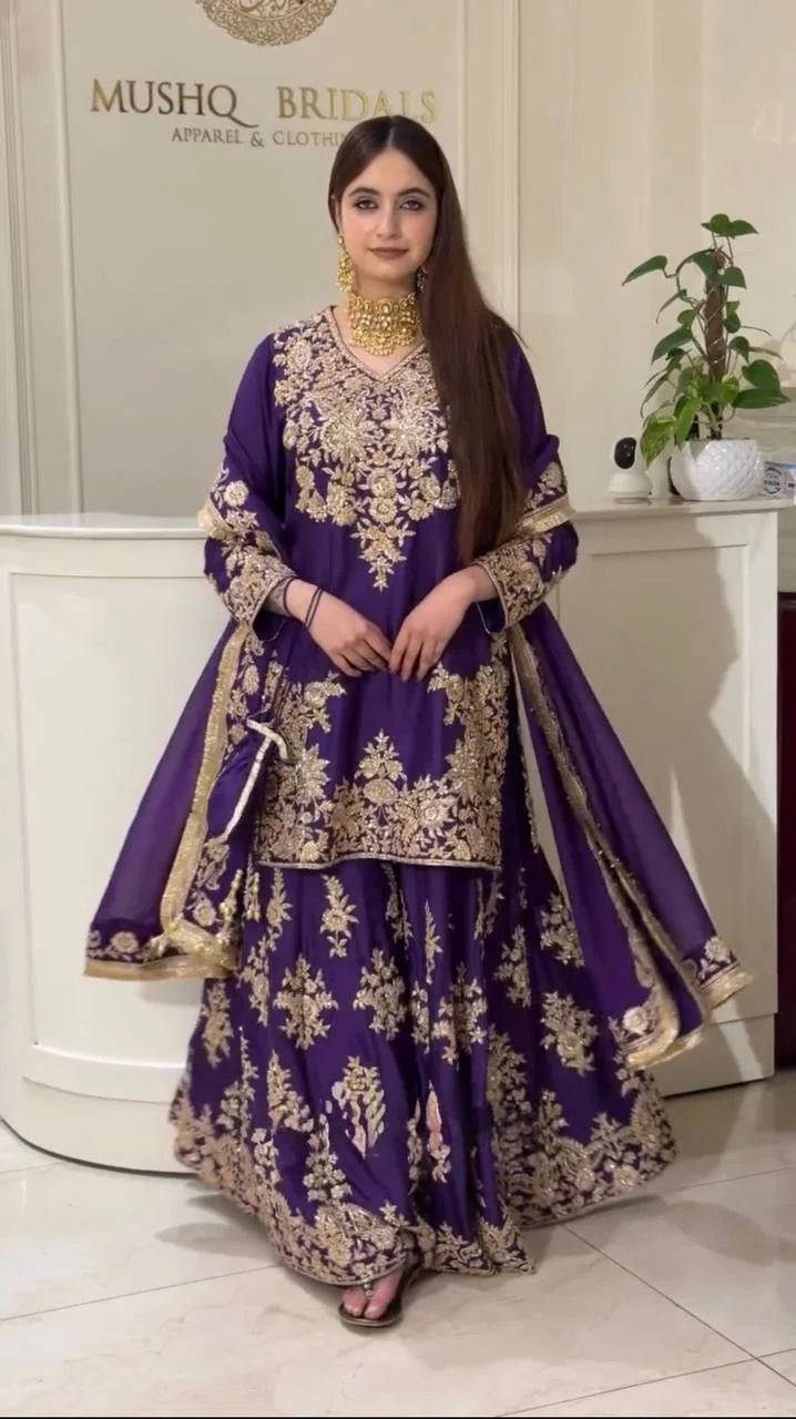 Model wearing purple chinon silk sharara set with dupatta drape