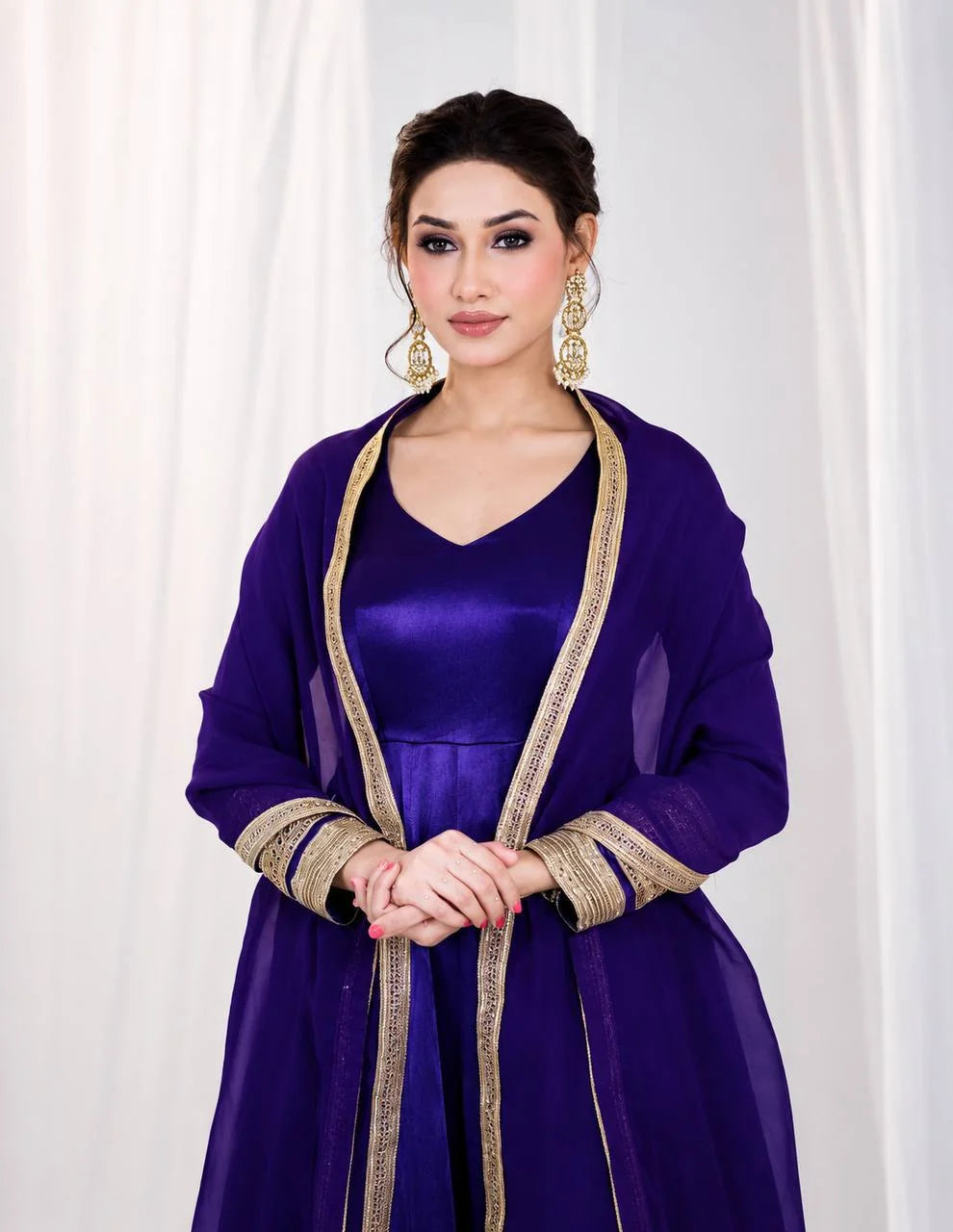 Purple silk anarkali gown close-up showing gold codding embroidery and dupatta