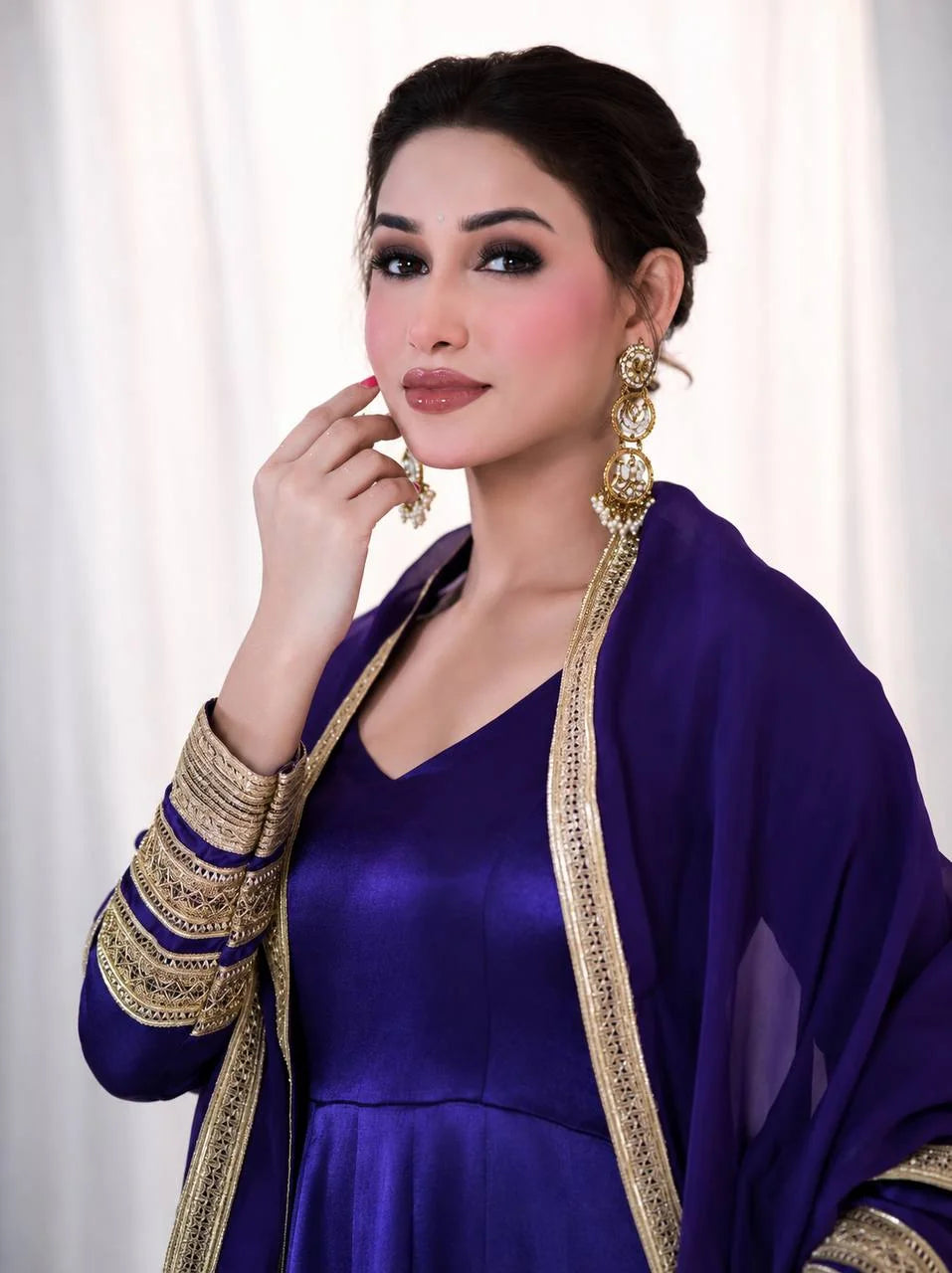 Dense gold codding and sequin work on sleeve of purple silk anarkali gown