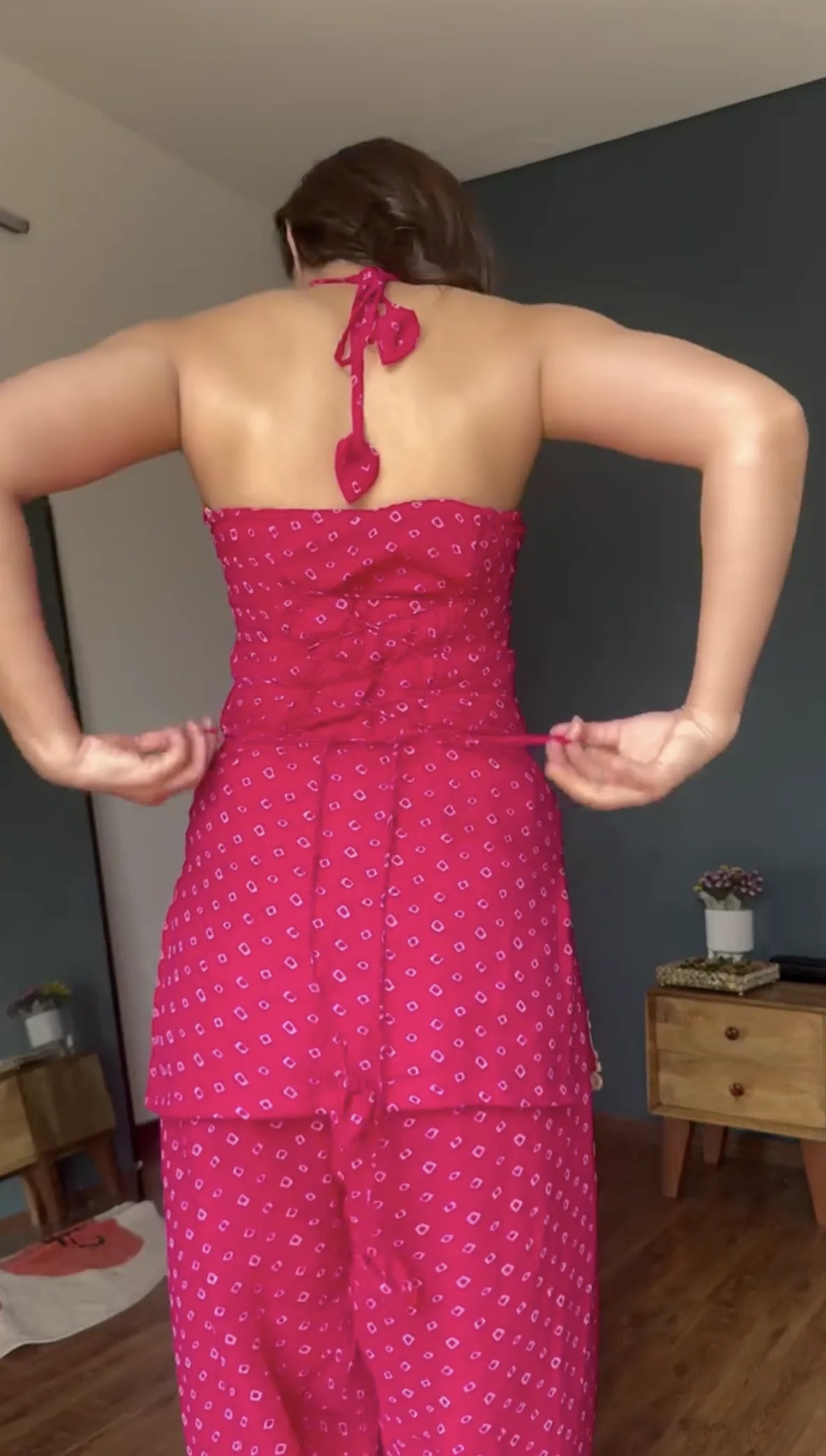Halter tie-back detail of rani pink bandhani foil georgette kurta patiyala set — back view