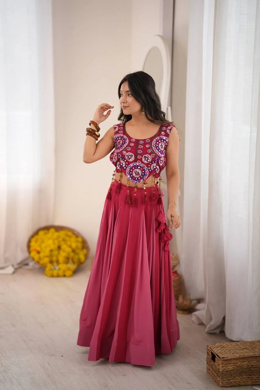 front view of rani pink crop top lehenga mirror work choli with beaded latkans