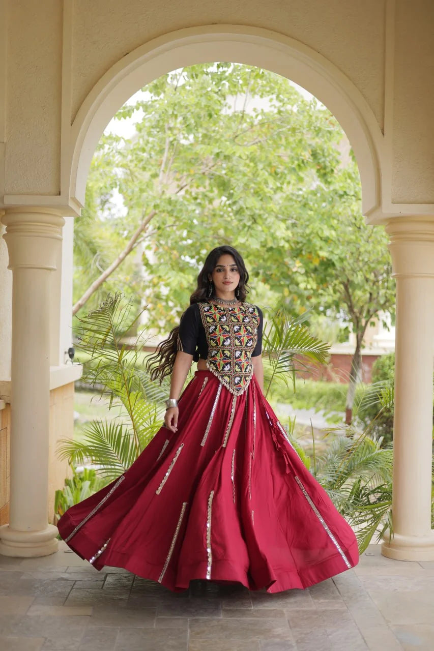Maroon chaniya choli twirl showing the six-metre mirror-lace flair, dance view