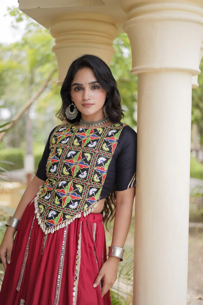 Maroon skirt with mirror-lace strips and a black Kutchi embroidered blouse, view