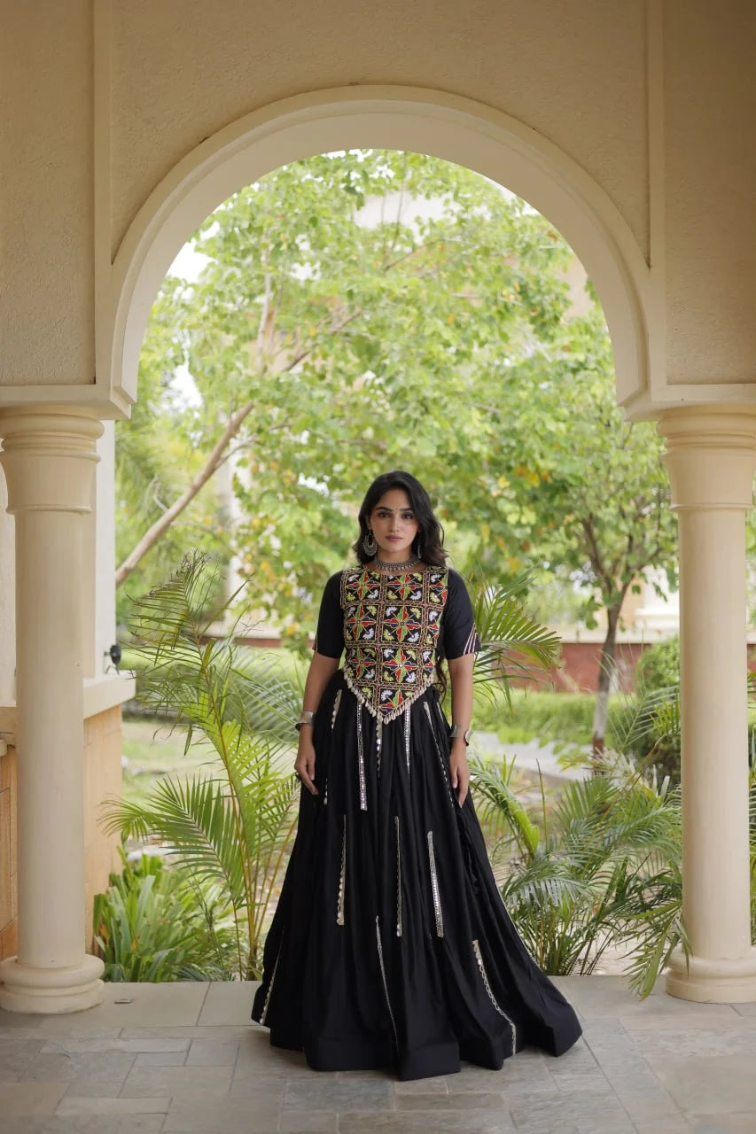 Rayon chaniya choli in black with Kutchi mirror crop blouse and flared skirt, front view